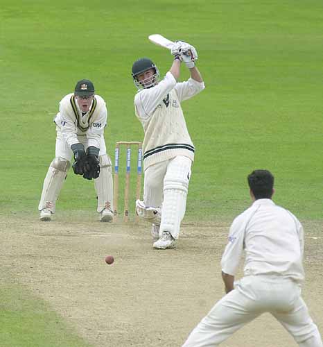 Andy Bichel drives Pietersen in his second innings of 43